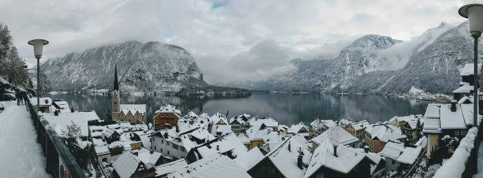 Panoramic photograph of a wintery town scene.